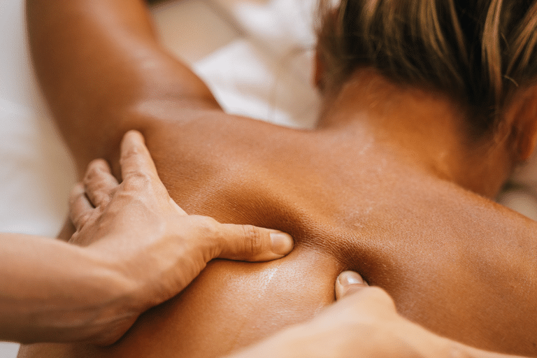 woman having a deep tissue massage treatment in question does massaging sore muscles really help